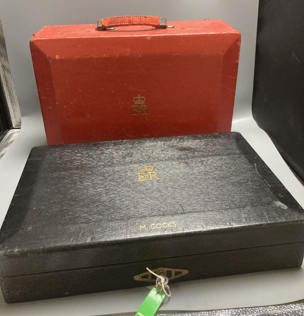 An antique parliamentary red leather despatch box and one other black box